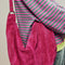 model wearing suede fuchsia slouchy tote bag