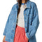 model wearing light denim oversized jacket with front patch pockets and button front