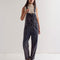 model wearing washed black relaxed fit overalls