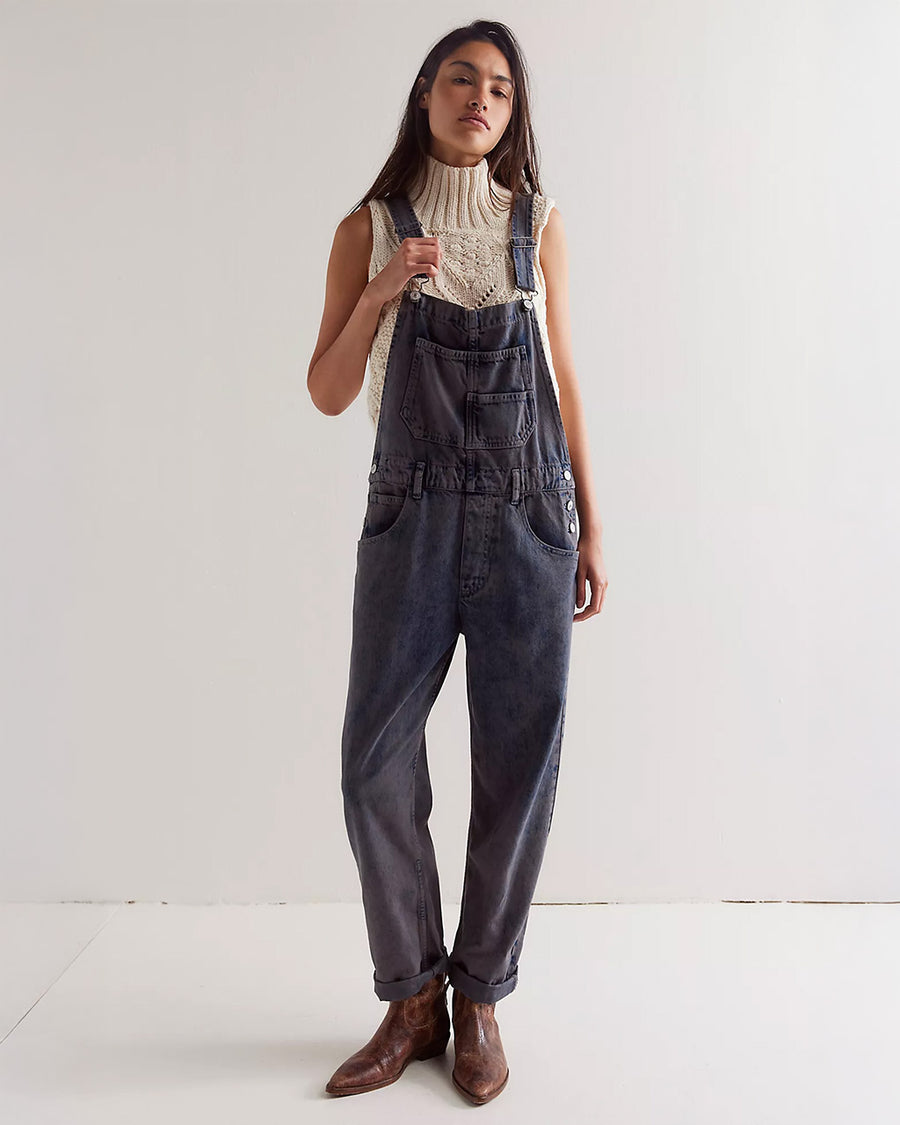 model wearing washed black relaxed fit overalls