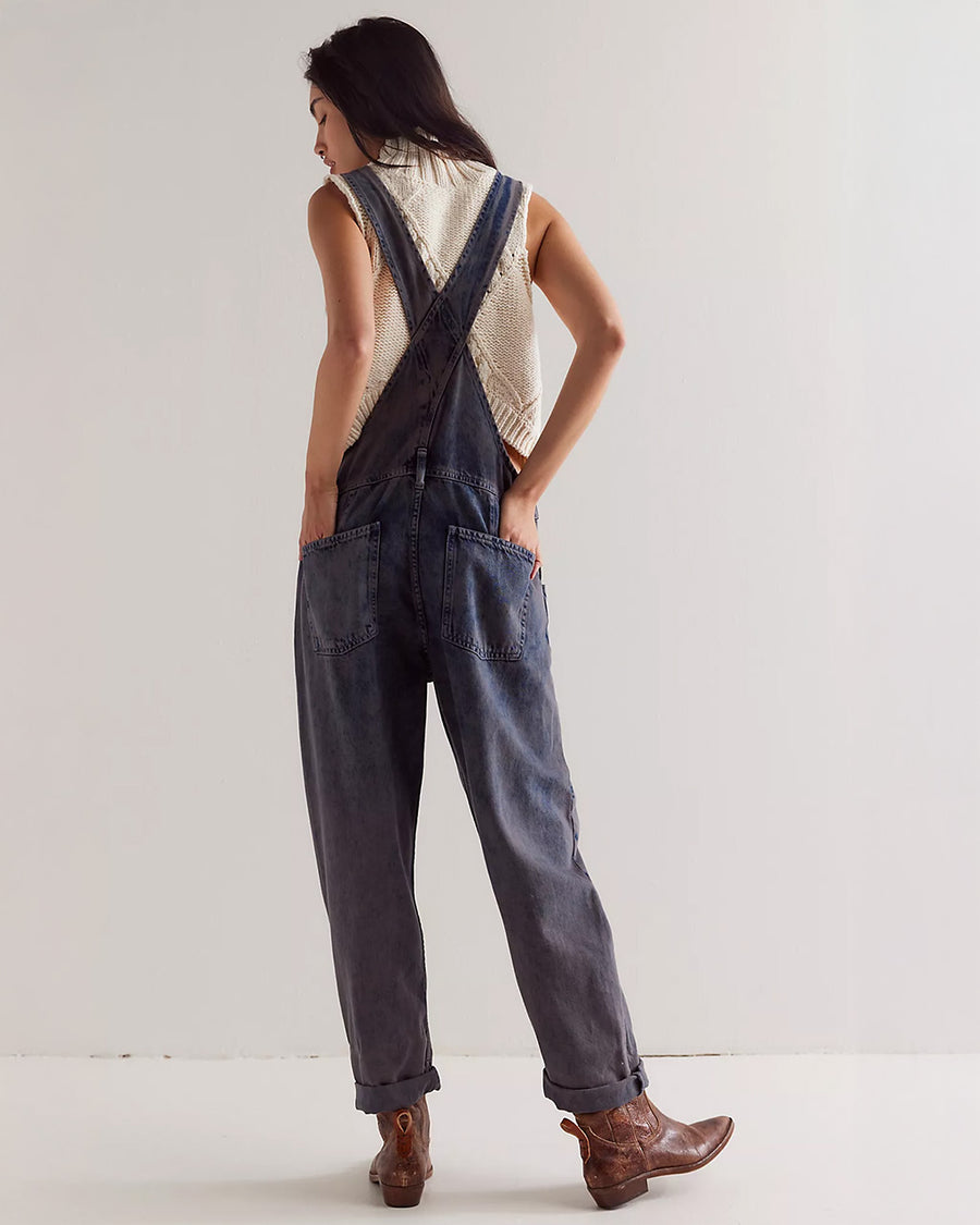 back view of model wearing washed black relaxed fit overalls