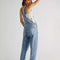 back view of model wearing light acid watch slouchy overalls