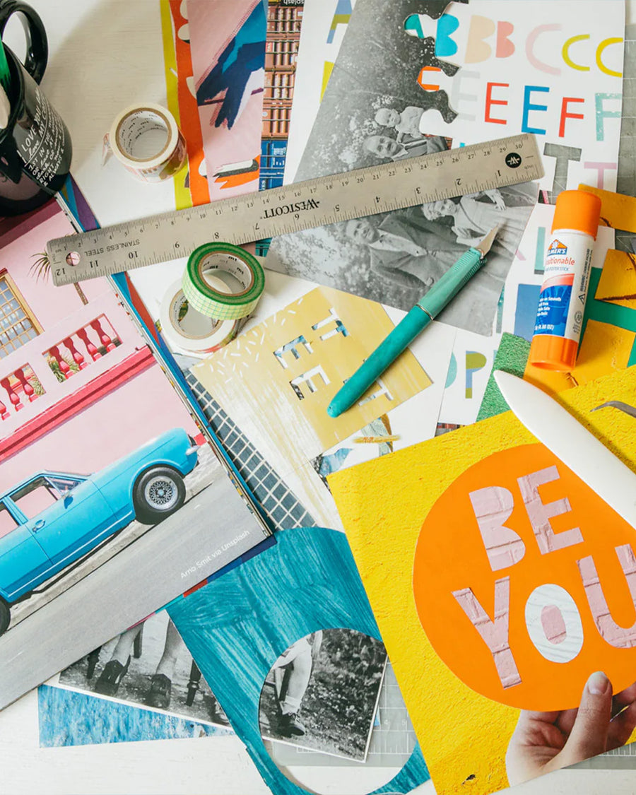 table scattered with colorful collage pages