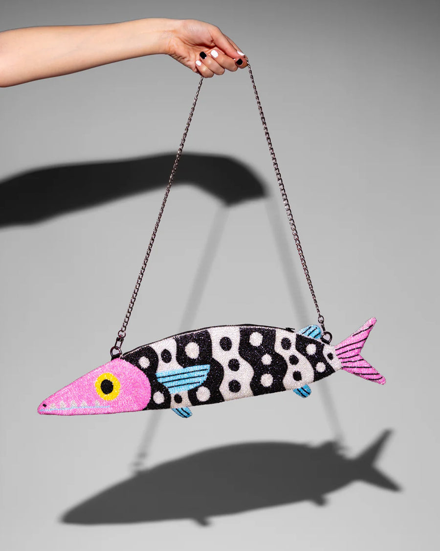 silver chain strap on black and white beaded fish shaped clutch bag with pink face and blue fins