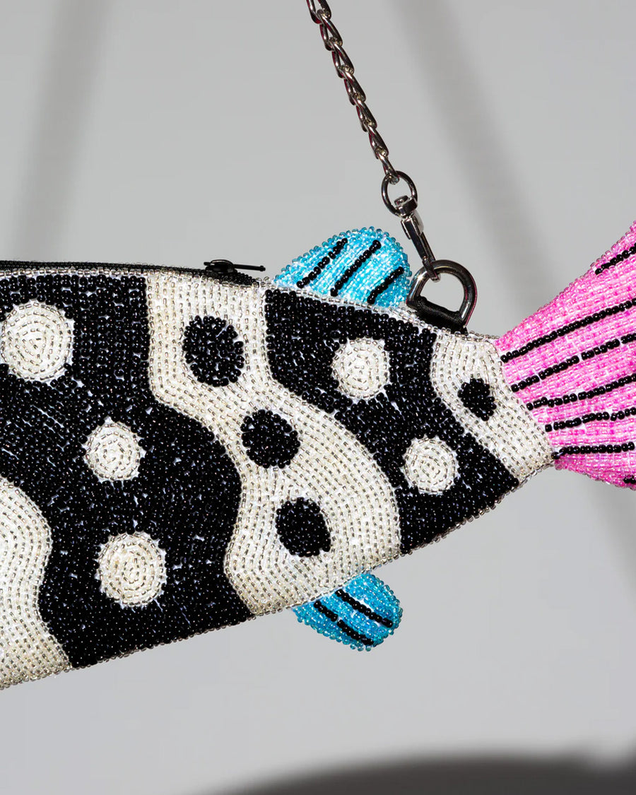 up close of beading on black and white beaded fish shaped clutch bag with pink face and blue fins