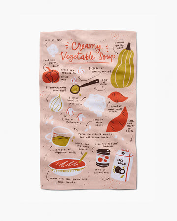 pink tea towel with creamy vegetable soup recipe