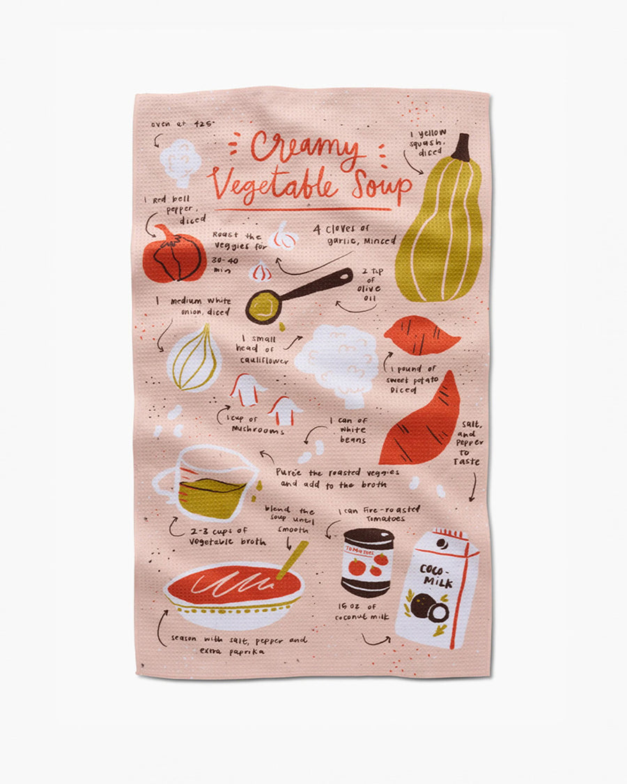 pink tea towel with creamy vegetable soup recipe