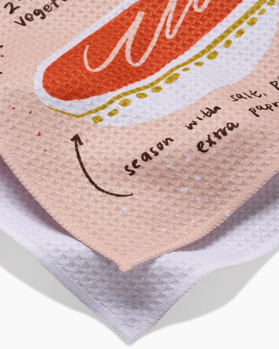 up close of pink tea towel with creamy vegetable soup recipe