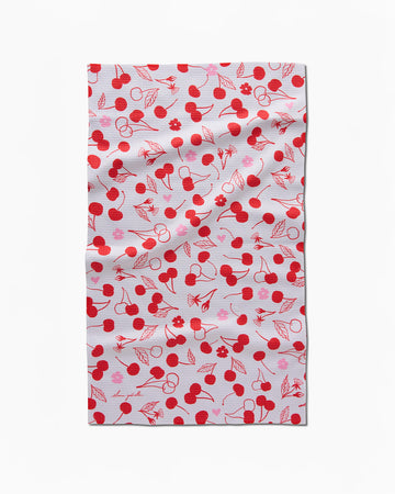 grey tea towel with red and pink cherry and flower print