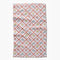 light pink cottagecore tea towel with delicate floral and criss cross pattern