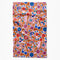 burnt orange tea towel with abstract fruit print