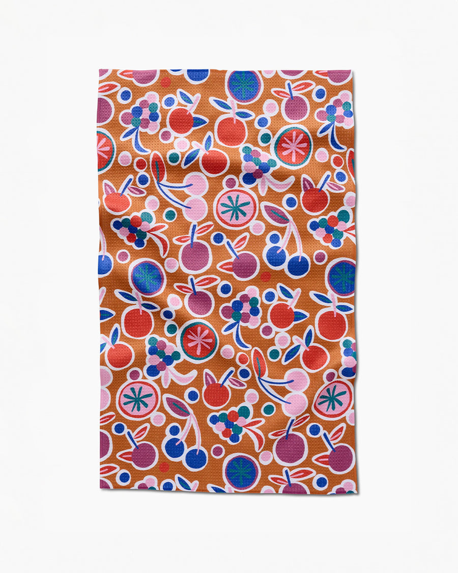 burnt orange tea towel with abstract fruit print