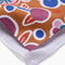 up close of burnt orange tea towel with abstract fruit print