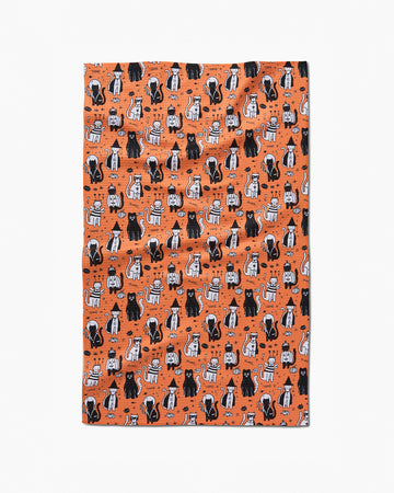 orange tea towel with cats in costumes print