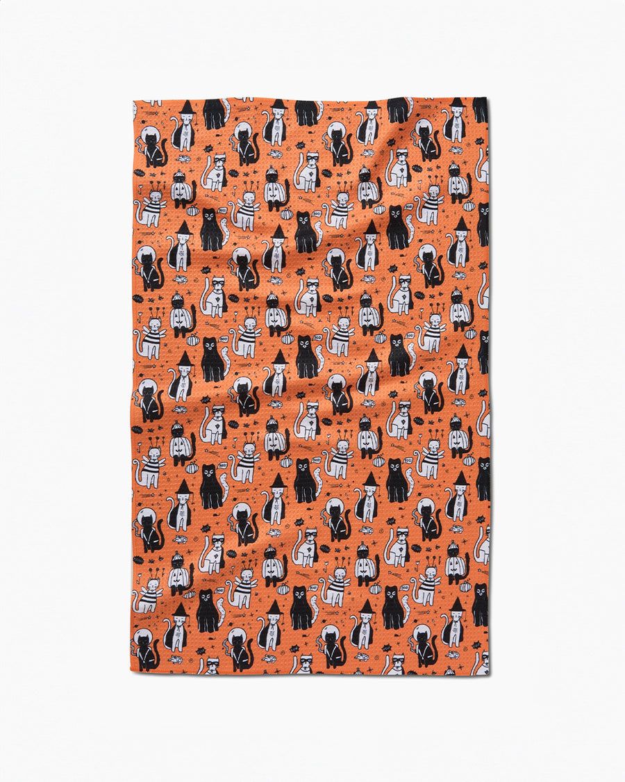 orange tea towel with cats in costumes print