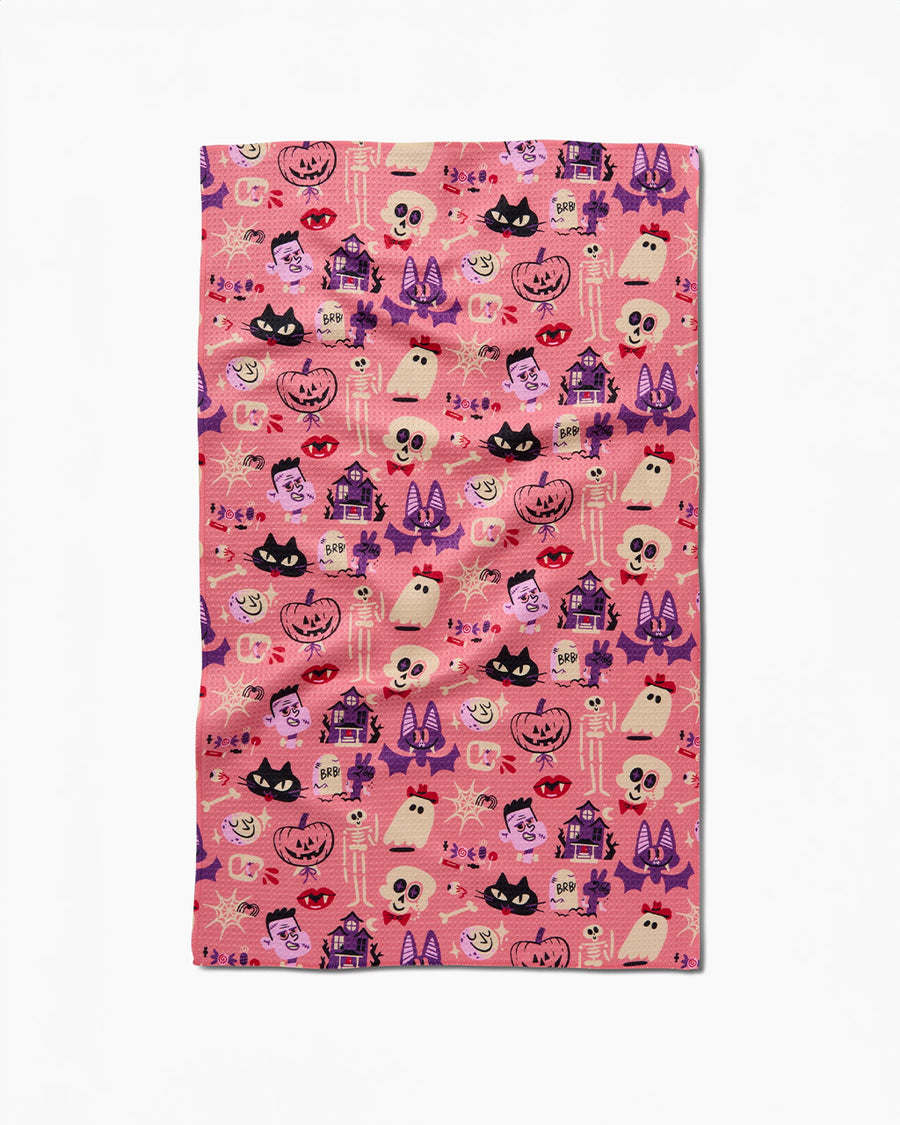 pink tea towel with halloween print