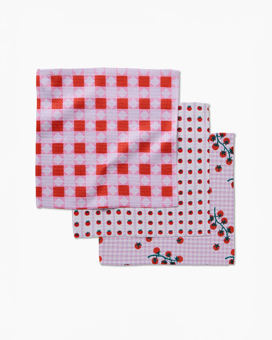 set of three dish cloths: pink patchwork, tomato stripe, and tomato gingham