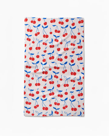 white tea towel with red and blue cherry print