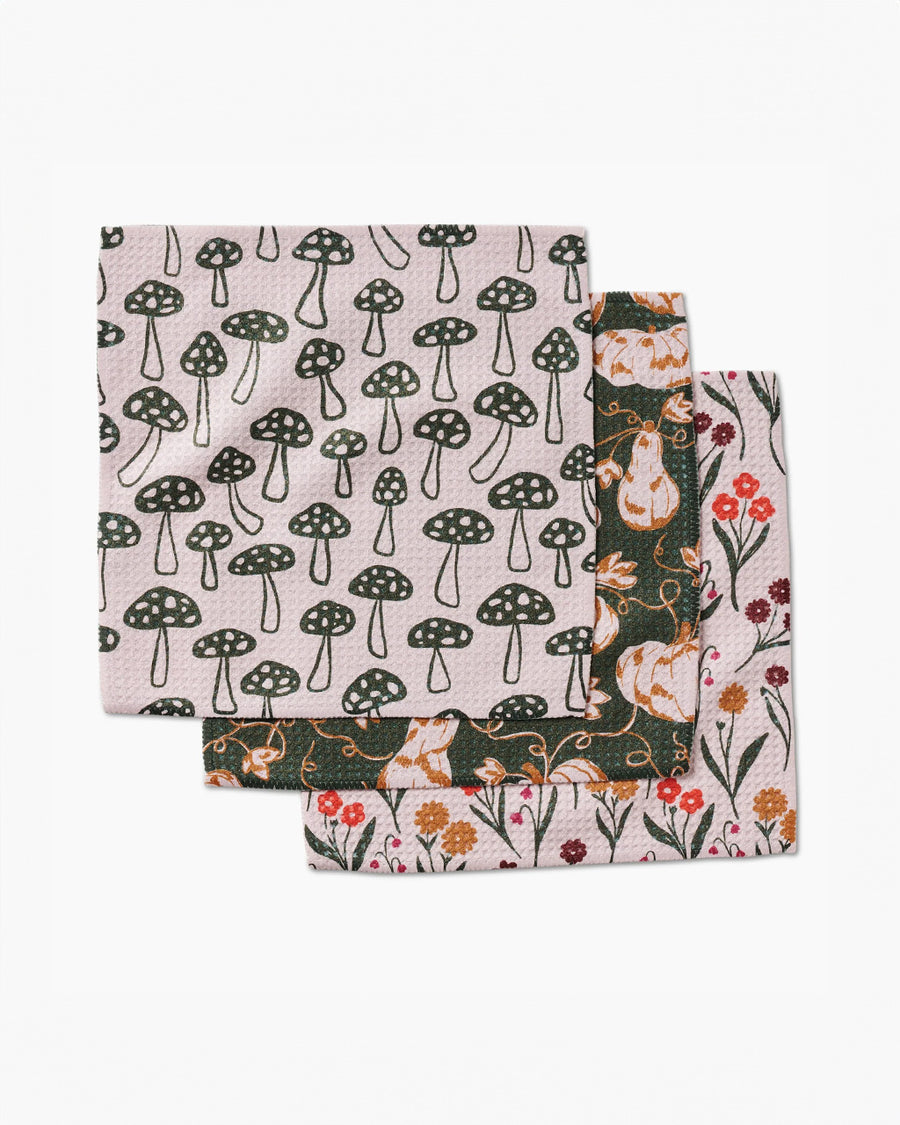 set of 3 dish cloths: sand with green mushrooms, dark green with pumpkin print and white floral print