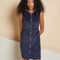 model wearing blue corduroy mini dress with colorful button front