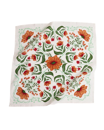 white square bandana with rust colored flowers and green leaf print