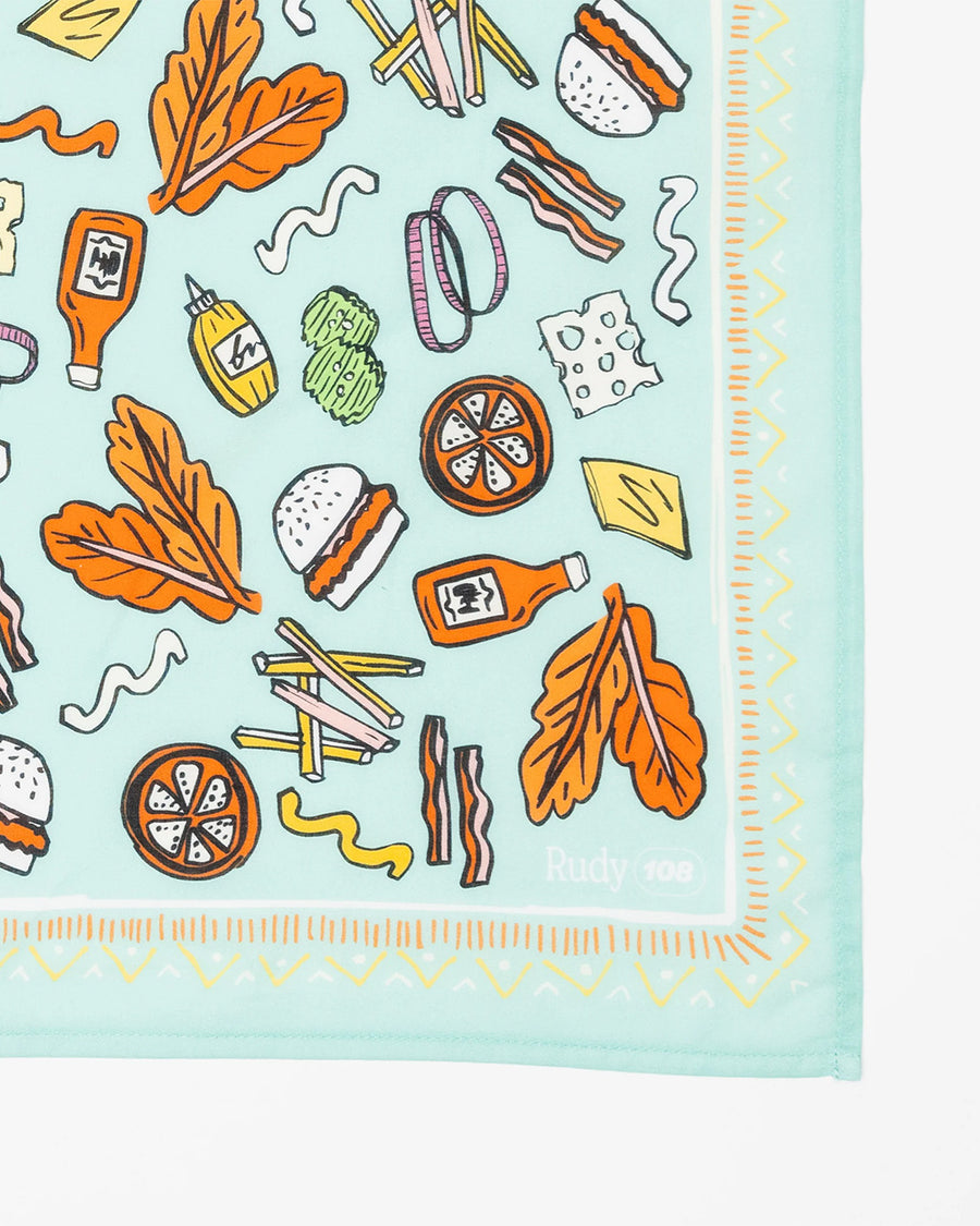 up close of square bandana with various burger and fry print