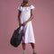 model holding black paper crochet bag