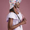 side view of model wearing white tulip bucket hat with colorful floral print