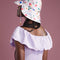 back view of model wearing white tulip bucket hat with colorful floral print