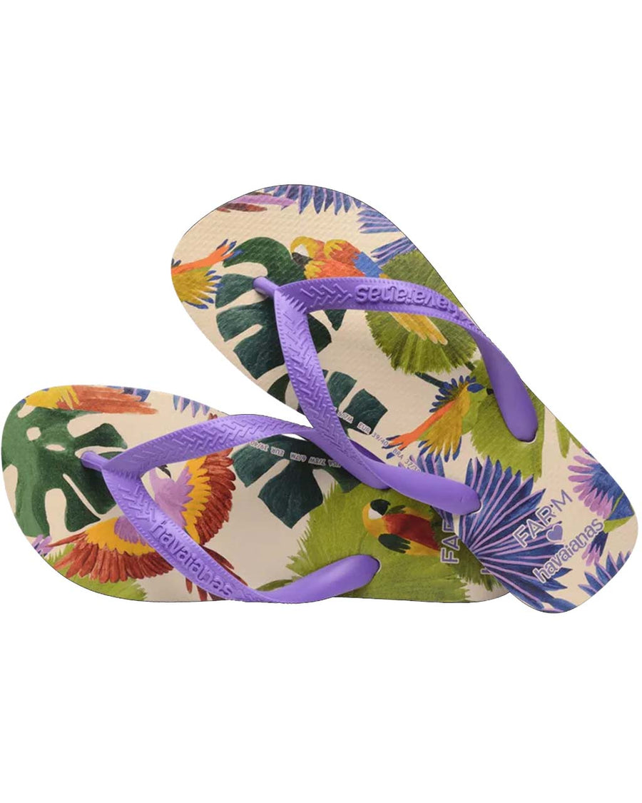 pair of tan flip flops with abstract parrot print