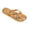 side view of tan flips flops with abstract spotted banana pattern
