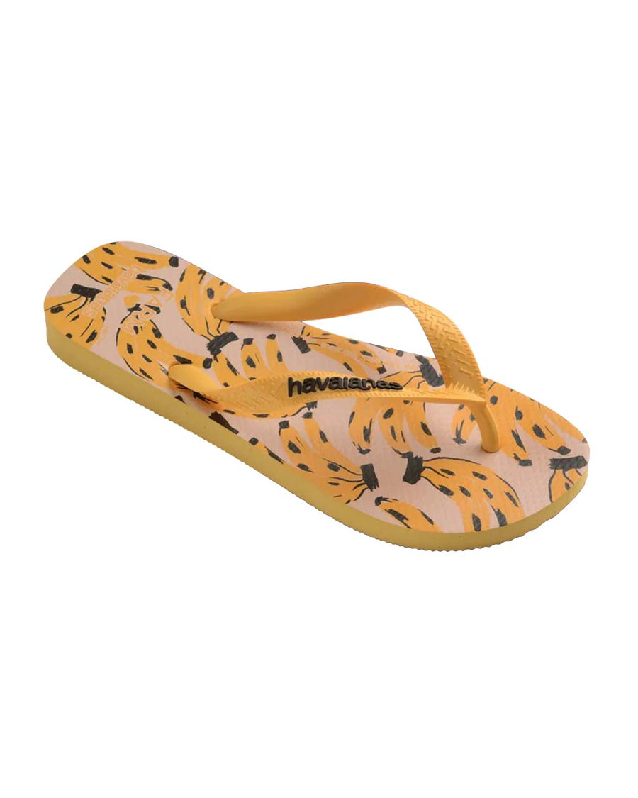 side view of tan flips flops with abstract spotted banana pattern