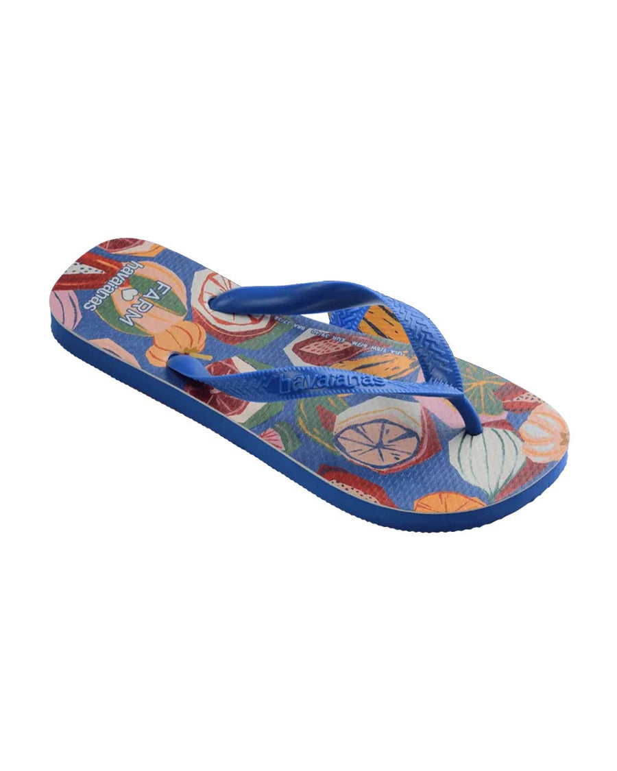side view of blue flip flops with abstract fruit print