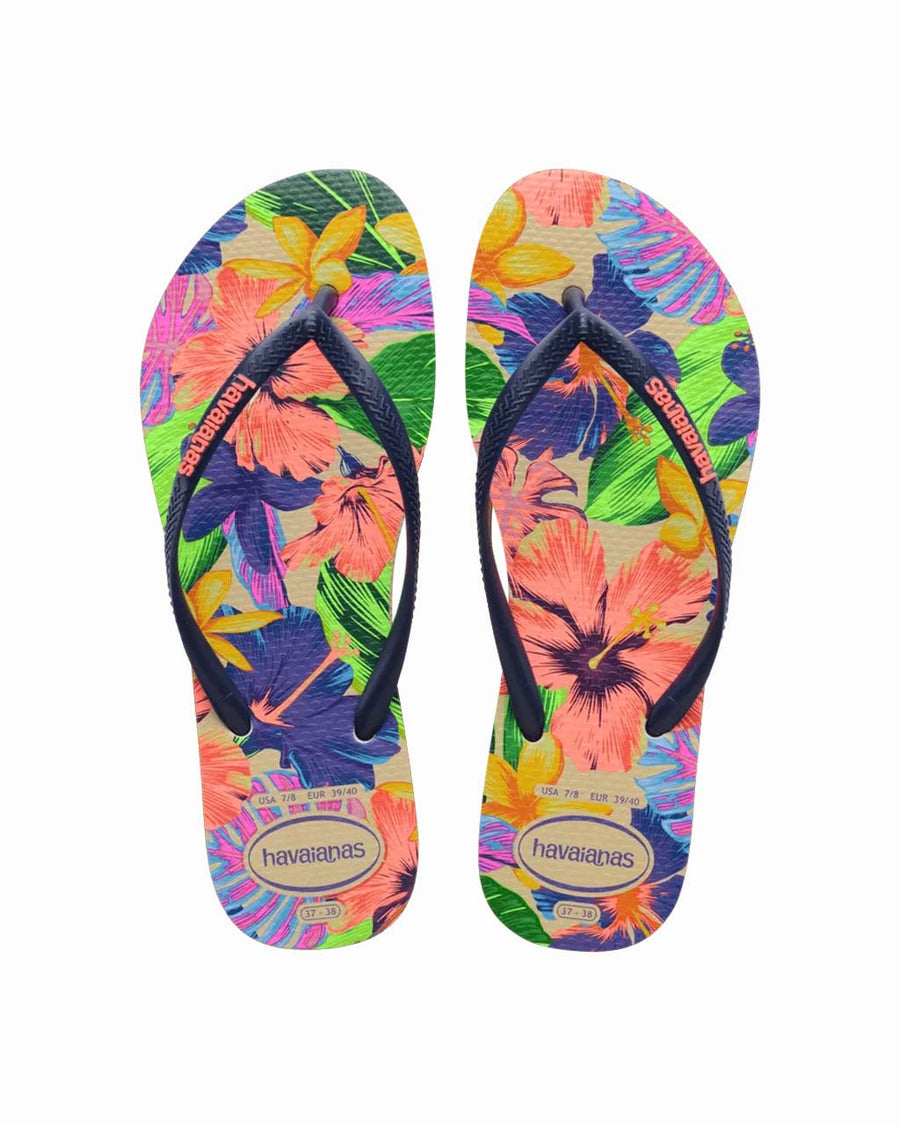 pair of colorful neon floral print flip flops with navy thin straps