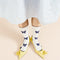 model wearing white crew socks with blue bow print