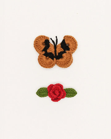 set of two hair clips: camel and black crochet butterfly and red rosebud