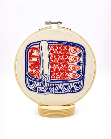 red and blue tin sardine embroidery kit