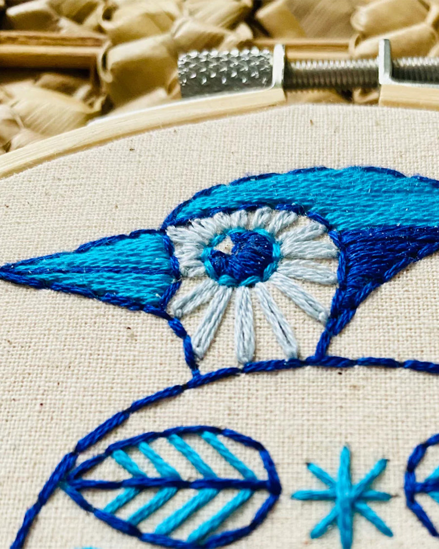 up close of blue folk blue jay embroidery kit