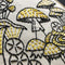 up close of black and yellow mushroom embroidery kit