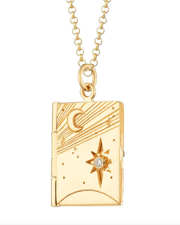 gold locket necklace with celestial scene