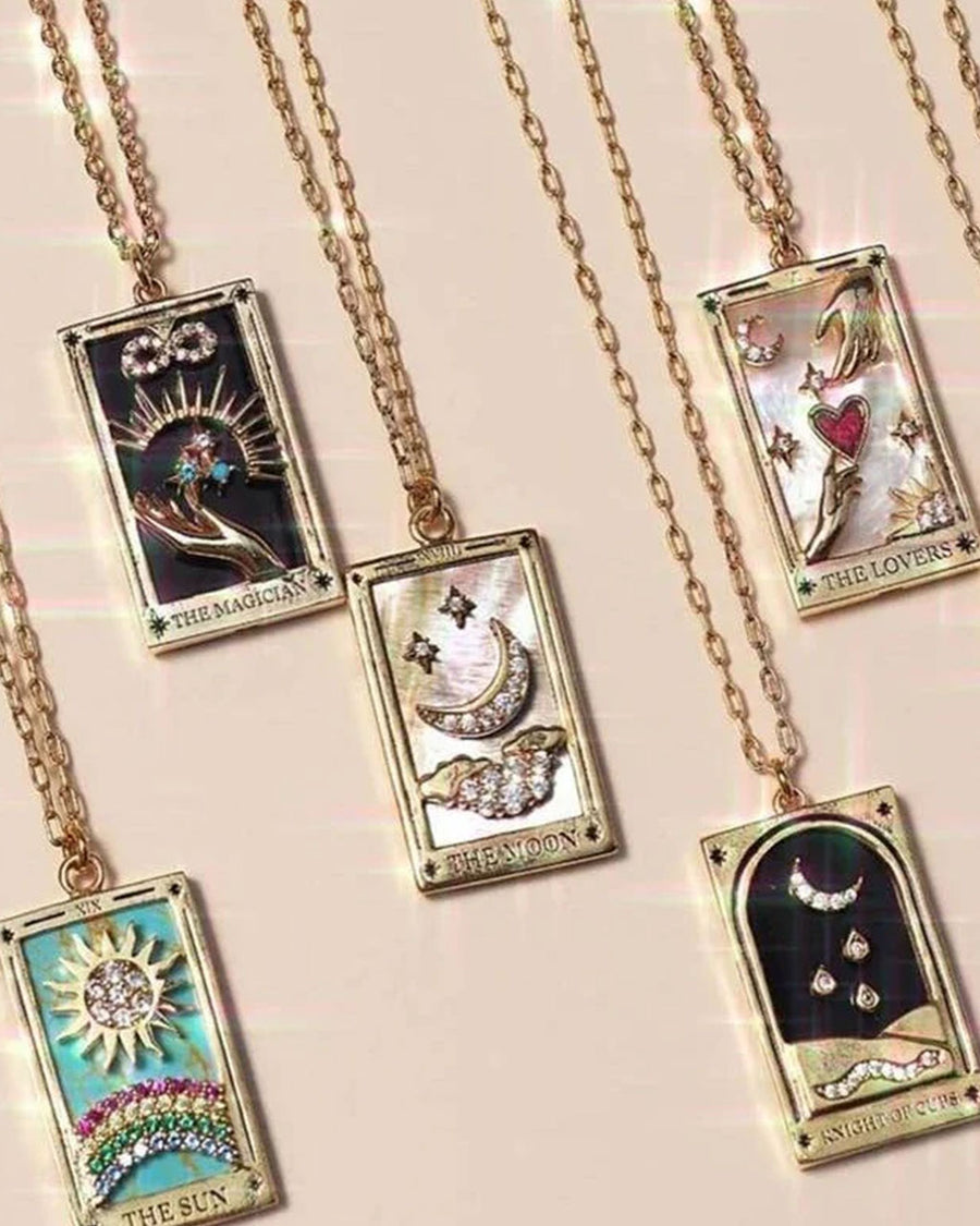 display of knight of cups tarot card gold necklace