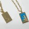 front and back of blue queen of cups tarot card gold necklace