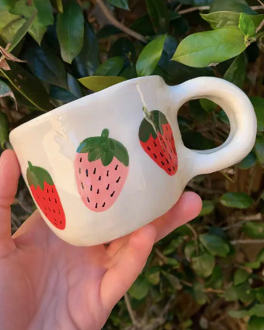 white mug with strawberry print