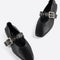 black mary jane flats with elastic back and thick buckle strap with silver grommets and buckle