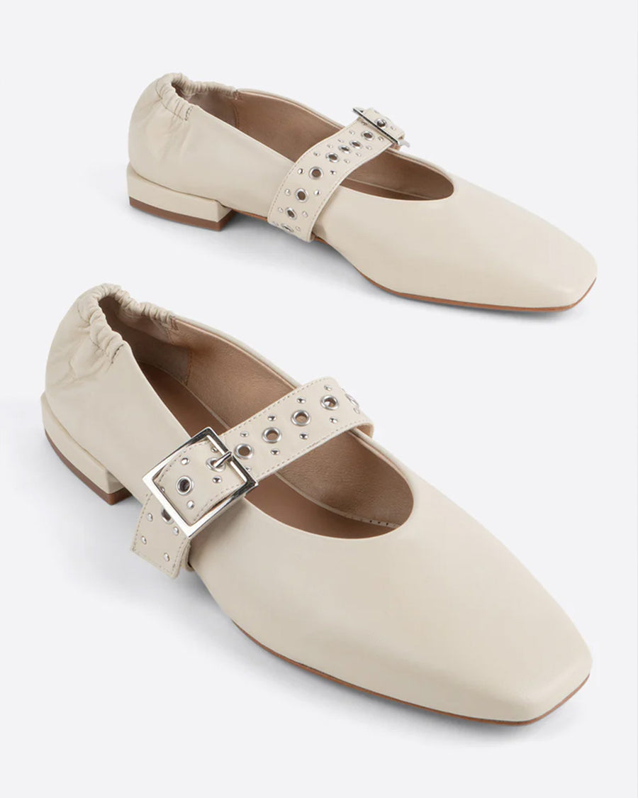 creme mary jane flats with elastic back and thick buckle strap with silver grommets and buckle