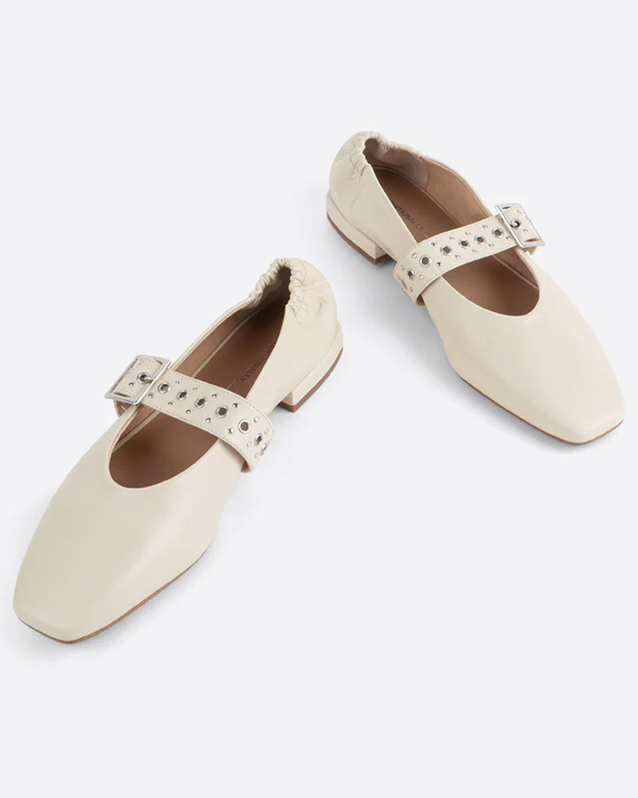 creme mary jane flats with elastic back and thick buckle strap with silver grommets and buckle