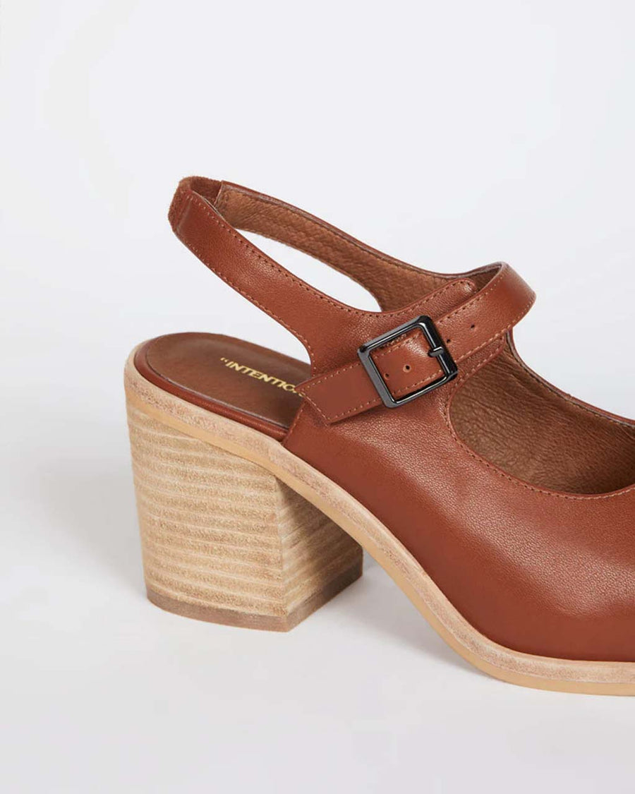 back view of dark brown square toed clog with buckle and back strap