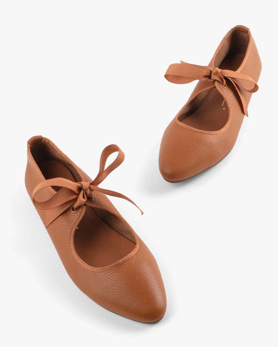 camel colored flats with tie buckle