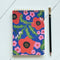 blue jotter notebook with red abstract floral print