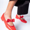 model wearing cherry red mary jane shoes with bow strap